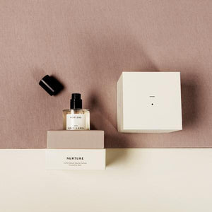 bottle of 100% natural perfume with box by abel odor and gray label named nurture